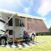 imageCamco RV Awning Shade Kit  Provides Additional Shade and Helps Lower The Temperature Under RV Awning  Measures 54inches x 180inches  51455Brown