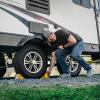 imageCamco Camper ampamp RV Wheel Chock with Rope  Keeps Trailer inPlace to Safely Unhitch or Park  Compatible with Wheels Up to 26 in Diameter ampamp Molded of HeavyDuty Hard Plastic  2Pack  44471w Rope Design