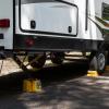 imageCamco Standard Wheel Chock for Trailers ampamp RVs  Heavy Duty Trailer Wheel Chock Constructed of Durable Plastic wUV inhibitors  for Use wTires Up to 26inches  ReHitch in Confidence  44412Large w Rope